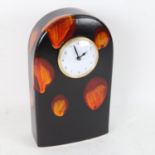 A Poole Pottery black ground dome-top mantel clock, height 22cm