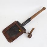 A Second World War British Army German-Pattern trench shovel, with original leather cover and