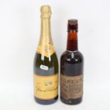 A bottle of Forest Brown Ale, and a bottle of Duc De Cherence Vin Mousseux