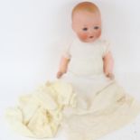 A German Armand Marseille baby doll, with bisque porcelain head and composition limbs, 41cm