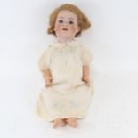 A German Simon & Halbig doll, with bisque porcelain head and jointed composition limbs, 59cm