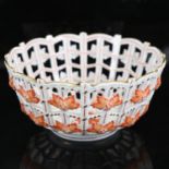 A Hungarian Herend porcelain basketweave bowl, hand painted and gilded floral decoration, no. 7473/