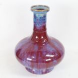 A Chinese sang de boeuf pottery squat bottle vase, seal mark on base, height 24cm