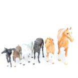 A group of Beswick horses, including a large Palomino, height 28.5cm, and Black Beauty and foal