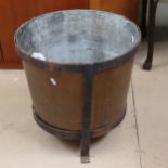 A copper pot in iron stand, height 43cm