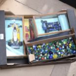 A box of marbles, model cars, Monopoly etc