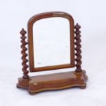 A small Victorian mahogany swing toilet mirror