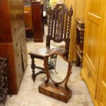 A Carolean style carved oak hall chair, and a mahogany box swing toilet mirror (2)