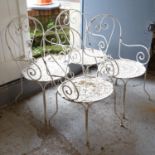 A set of 4 painted wrought-iron garden chairs
