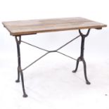 A rectangular oak-top garden table, on cast-iron base, W100cm, H72cm, D59cm