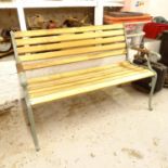 A painted iron-framed garden bench, with new slats, L130cm