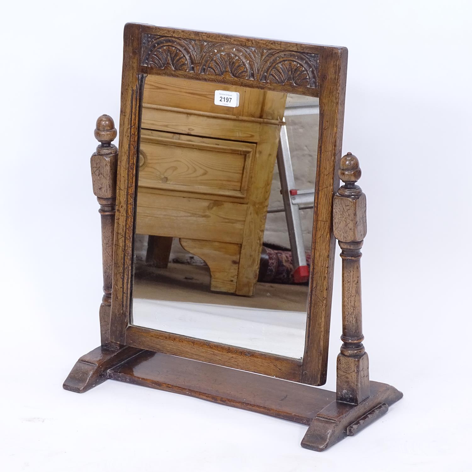 An Ipswich oak design swing toilet mirror, W50cm, H57cm