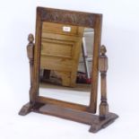 An Ipswich oak design swing toilet mirror, W50cm, H57cm