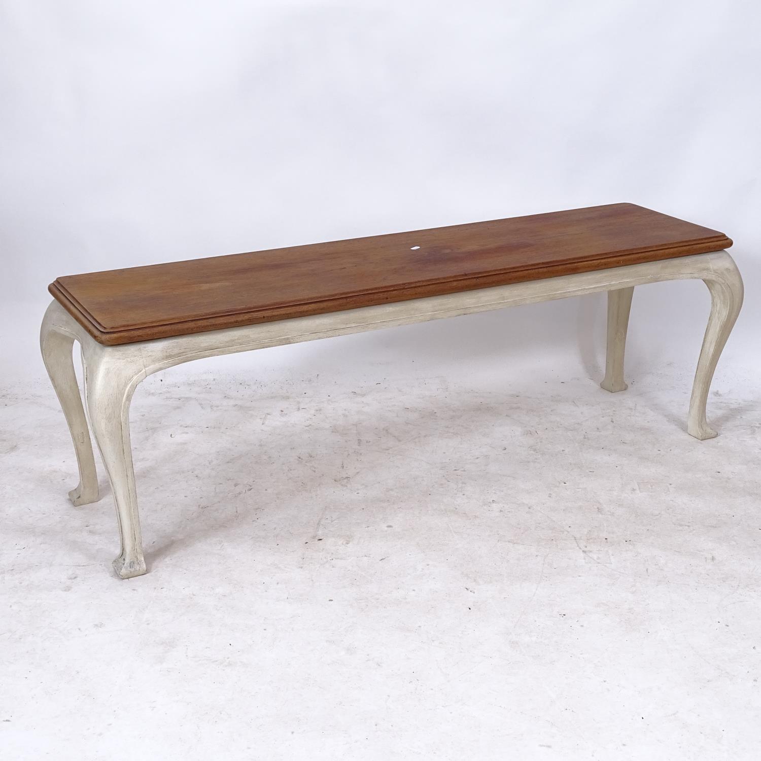 A rectangular polished and painted bench on cabriole legs, L140cm, H46cm, D38cm