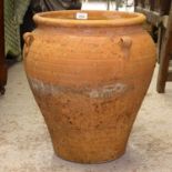 A 4-handled terracotta oil jar, W40cm, H46cm