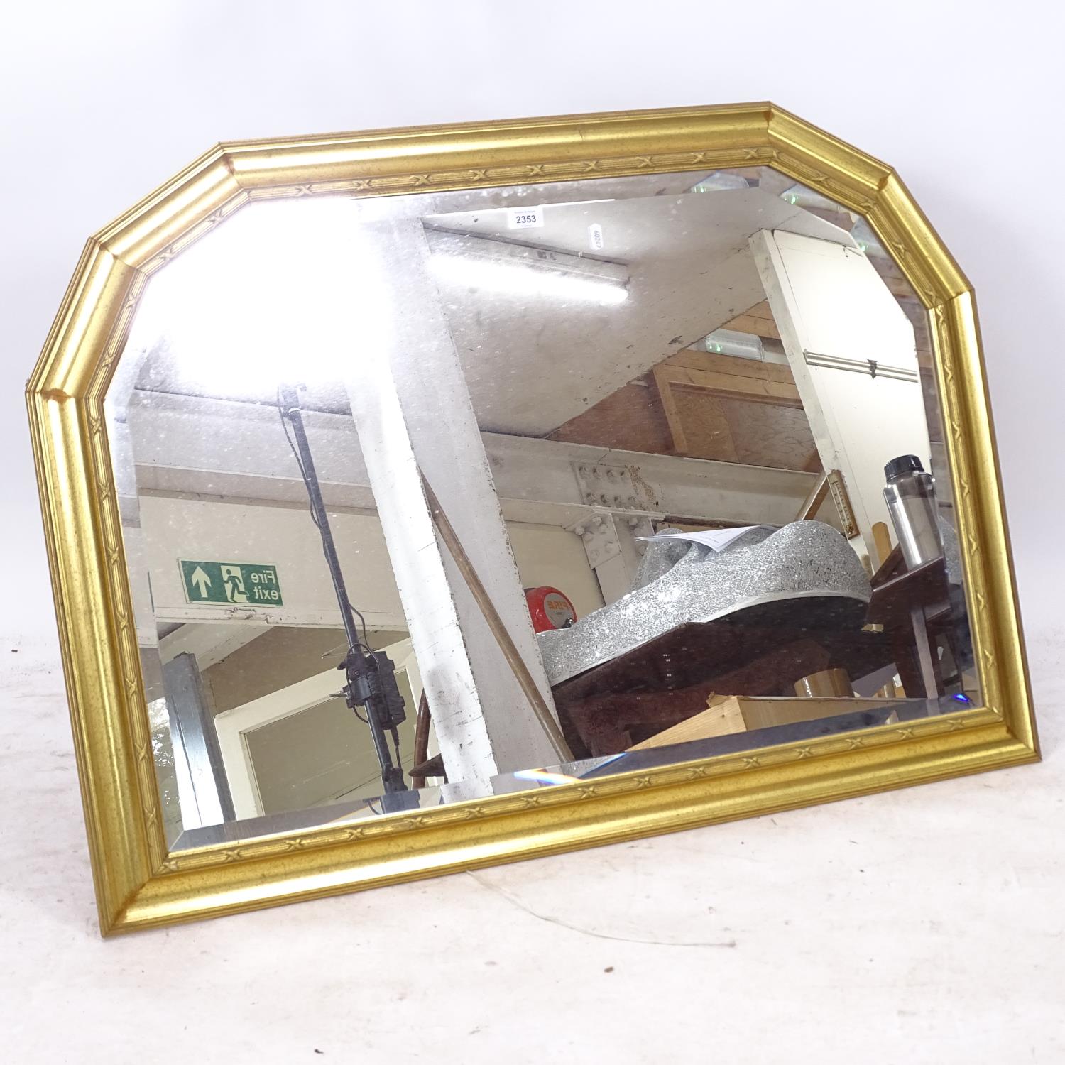 A modern gilt-framed arch-top oval mantel mirror, L104cm, H75cm