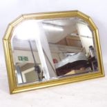 A modern gilt-framed arch-top oval mantel mirror, L104cm, H75cm