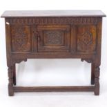 A 17th century style joined oak cabinet of small size, with Archadian and chip carved panelled front