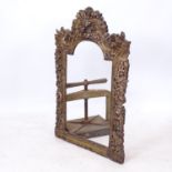 An ornate gilded and pierced arch-top picture frame, W70cm, H105cm
