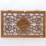 A Chinese elm relief carved and pierced rectangular panel, L97cm, H58cm