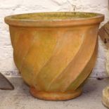 A large terracotta swirled garden pot, W52cm, H41cm