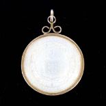 A Chinese mother of pearl gaming counter pendant, in 9ct gold frame, crest decoration with "Fide