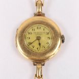 J W BENSON - a lady's Vintage 18ct gold mechanical bracelet watch, silvered dial with Arabic