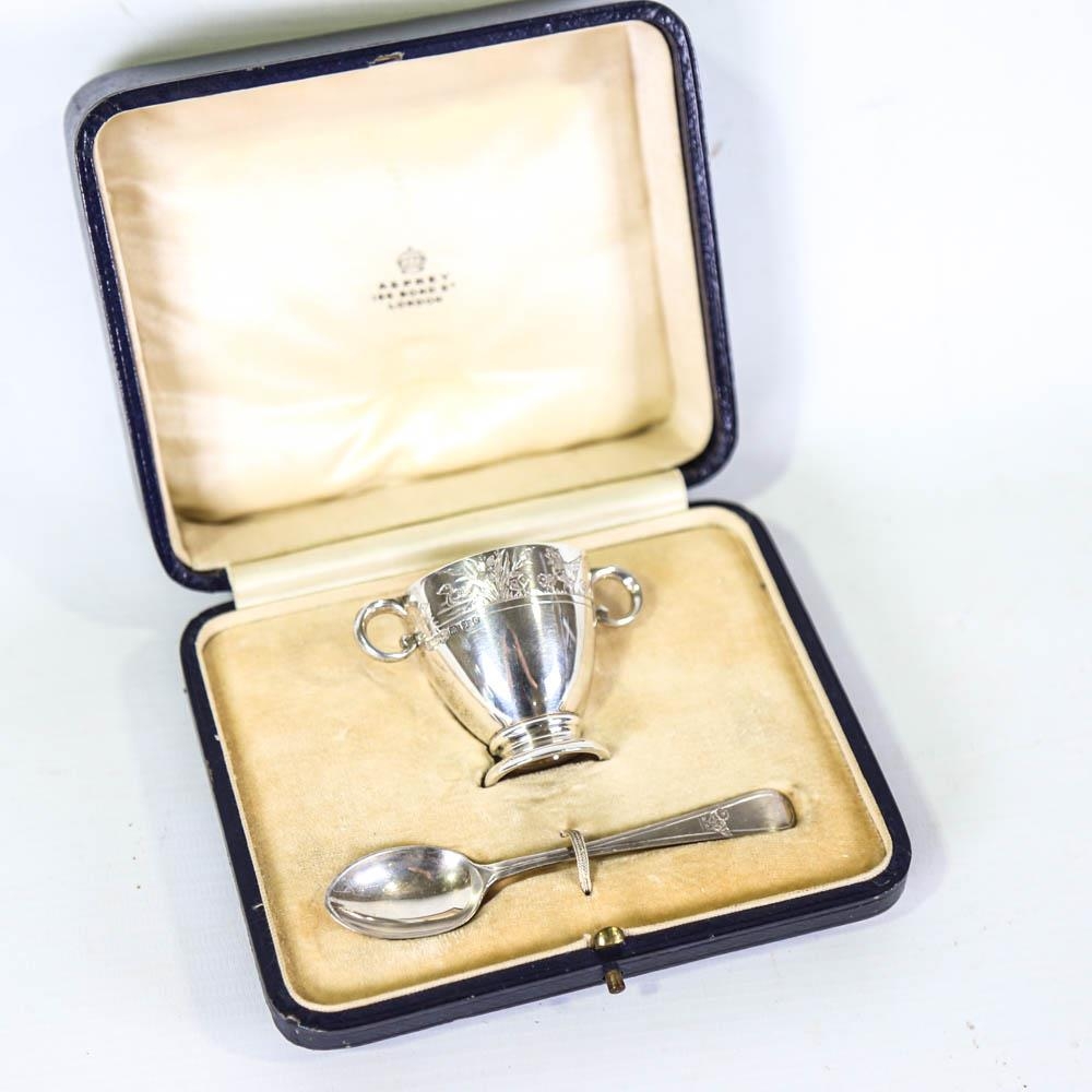 ASPREY - a cased George V silver egg cup and spoon set, engraved chick decoration, by Asprey & Co