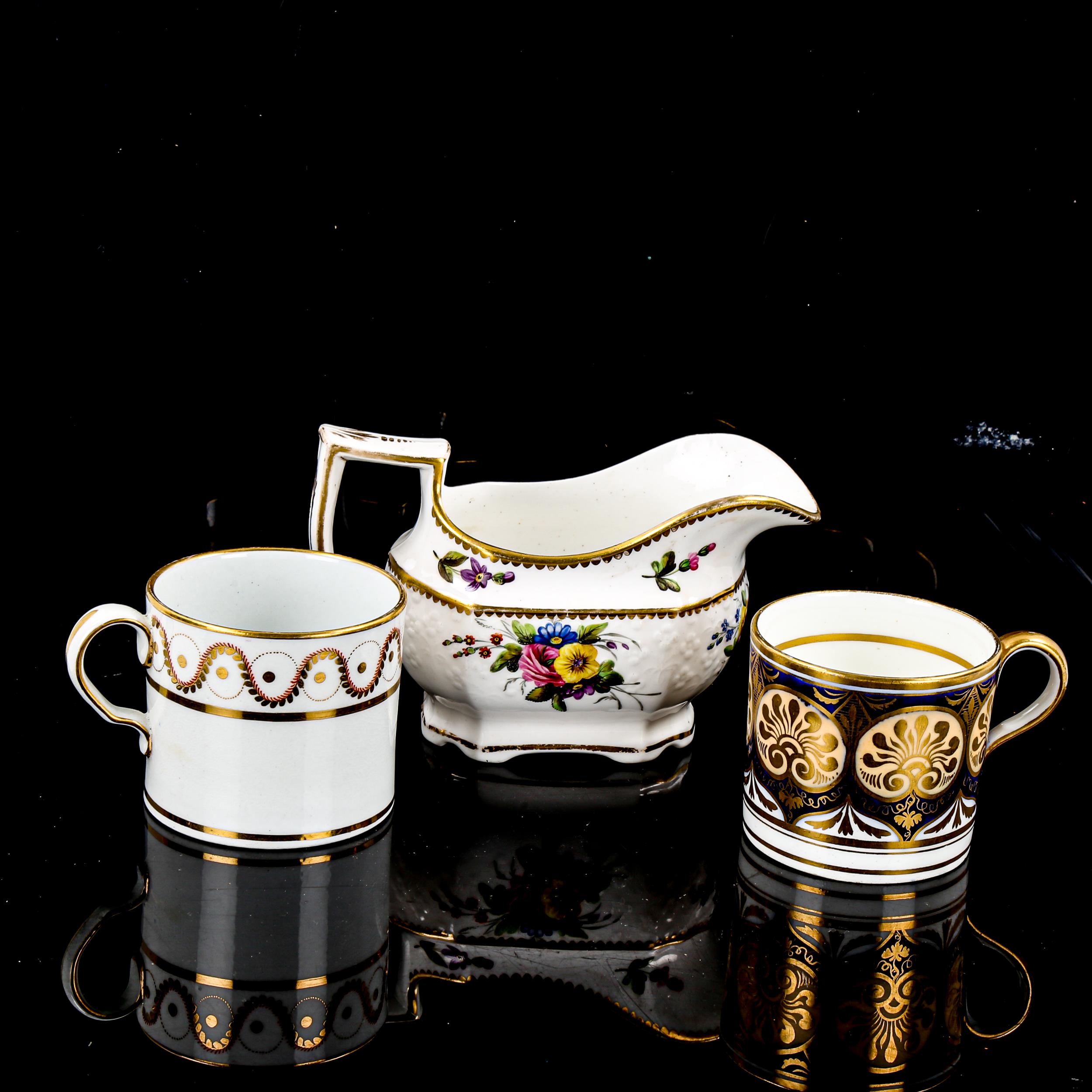 A Victorian Spode cream jug, with painted floral decoration, and 2 early English coffee cans (3)