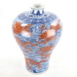 A Chinese blue and red painted porcelain vase, with dragon and sea design, seal mark, height 34cm