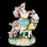 A 19th century Staffordshire Pottery figure of a woman and children on a goat, height 13.5cm