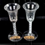 2 similar 18th century cordial glasses, with milk twist stems, height 17cm