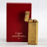 MUST DE CARTIER - a Vintage gold plated lighter, textured decoration, serial no. 09602T, height 7cm,