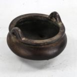 A Chinese patinated bronze incense burner, impressed seal mark under base, diameter 14cm