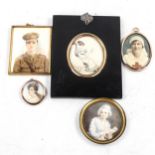 A group of miniature painted portraits and photographs, including a painting on ivory depicting a