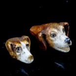 2 similar 19th century porcelain whistles, in the form of dog's heads, length 4.5cm and 3.5cm (2)