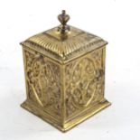 19th century heavy gauge brass tobacco jar and cover, with relief moulded design, height 13cm
