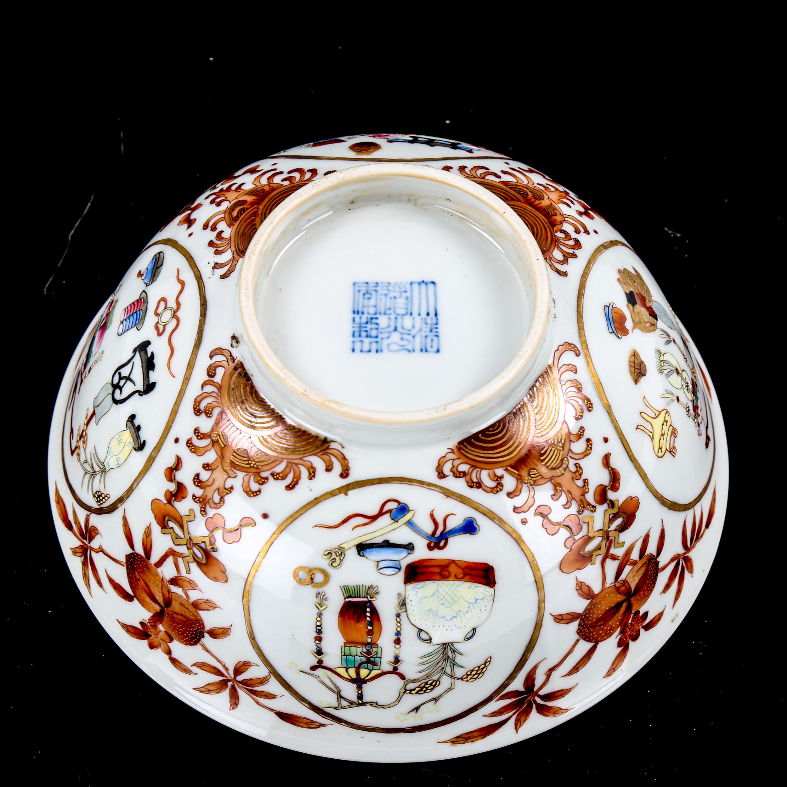 A Chinese porcelain bowl, with painted enamel panels, in iron red surround and blue painted - Image 3 of 3