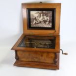 A 19th century table symphonion, floral marquetry inlaid case with brass mounts, transfer printed