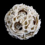 A Chinese carved ivory puzzle ball, late 19th/early 20th century, diameter 5cm