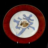 A Chinese porcelain plate, with painted central panel depicting a sage with deer, seal mark,