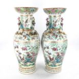 A pair of Chinese 19th century famille rose porcelain vases, with dragon and bird figures to the