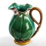 Minton Majolica pottery jug, lily flower and leaf moulded body, serial no. 1228, height 22cm