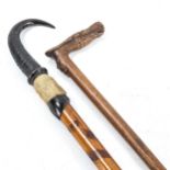 A Russian walking stick with carved horse-head handle, circa 1900, and an Alpine horn-handled stick,