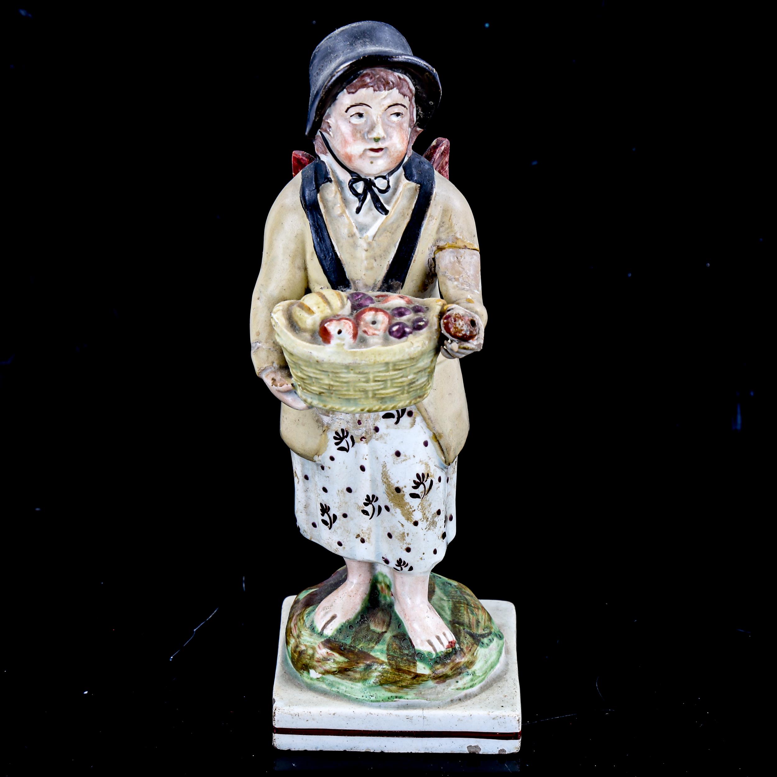 18th century Staffordshire Pearlware figure of a fruit seller, height 16cm (A/F)