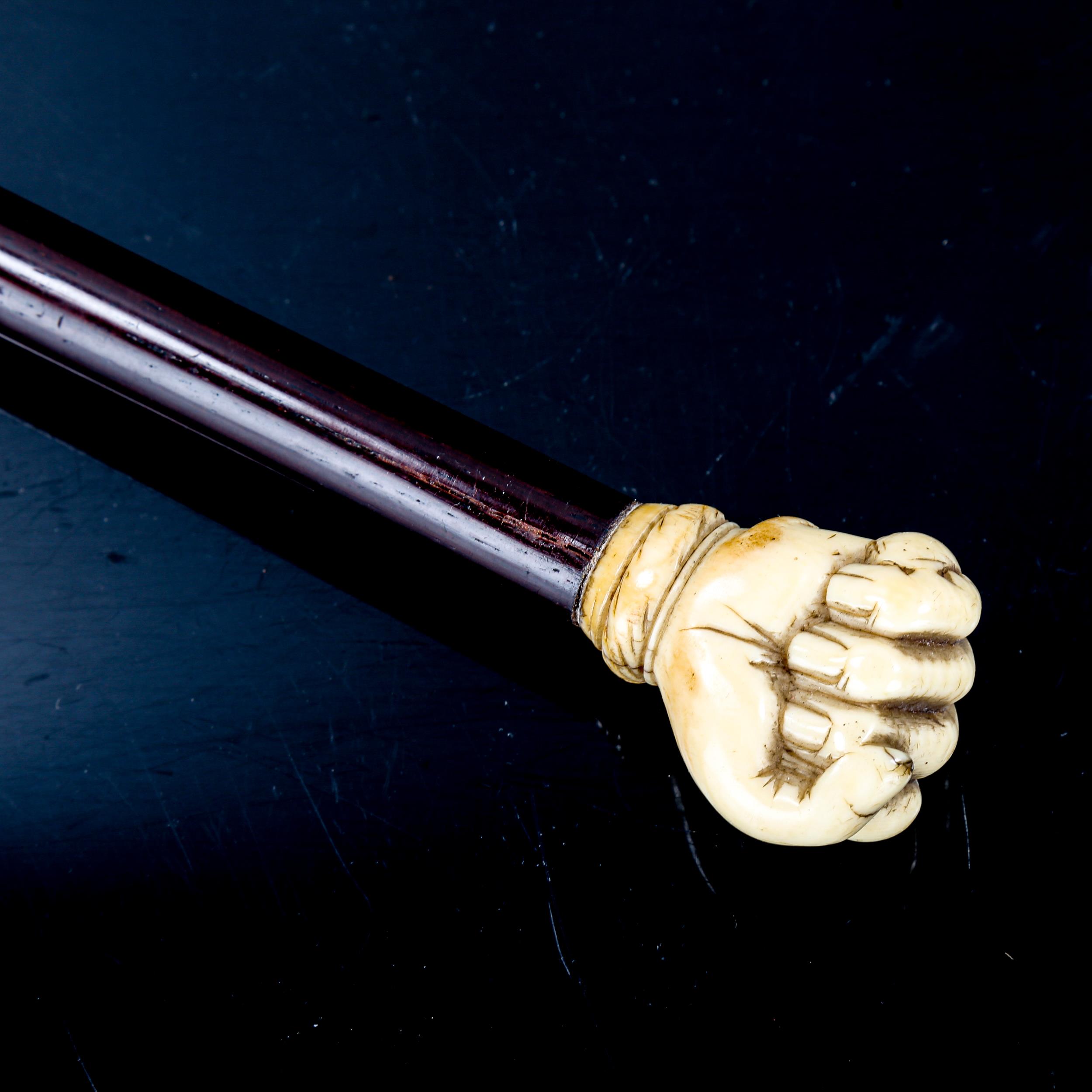 A marine ivory-handled walking stick, carved in the form of a fist holding a snake - Image 2 of 3