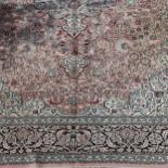 A large pink ground Persian rug, 370 x 274cm