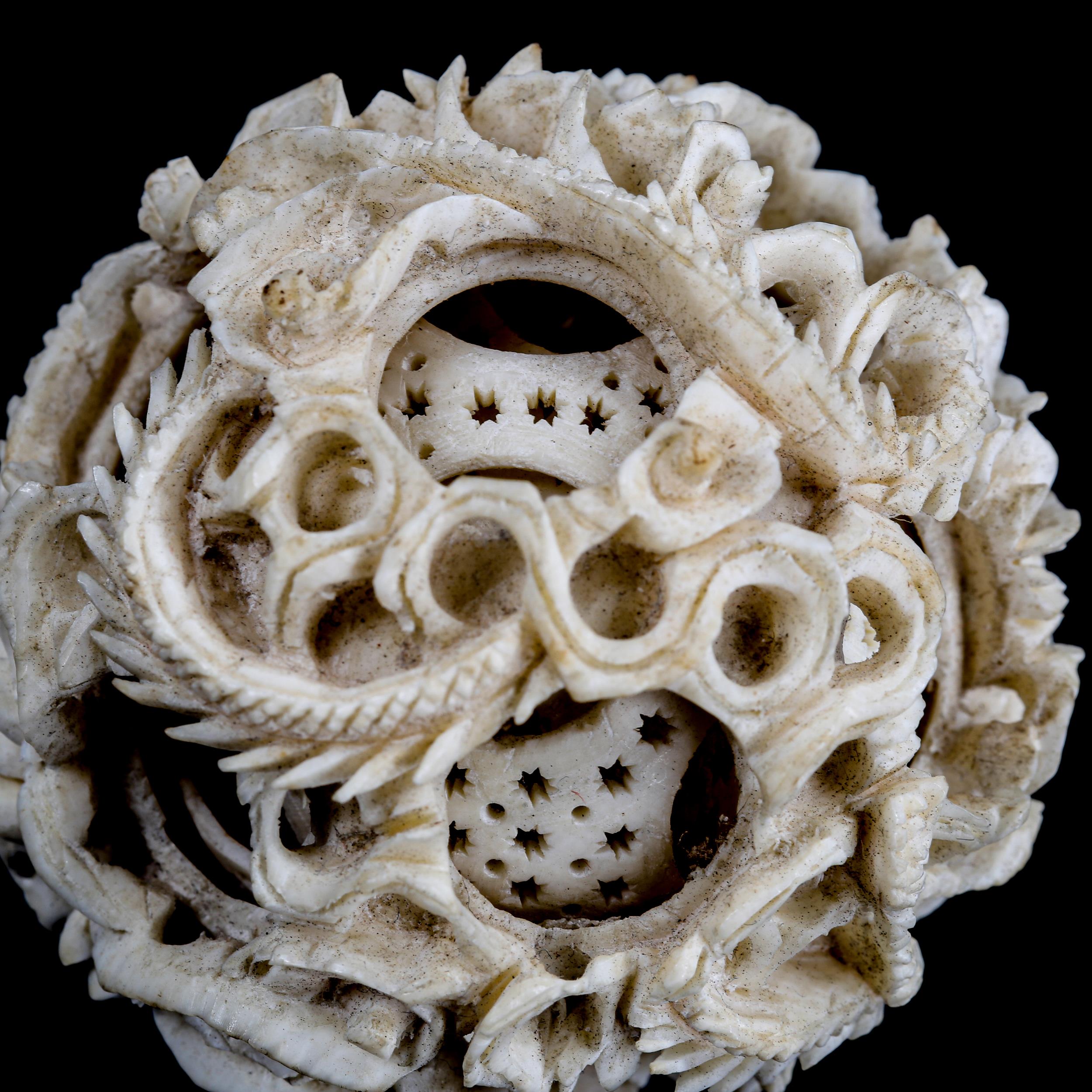 A Chinese carved ivory puzzle ball, late 19th/early 20th century, diameter 5cm - Image 3 of 3