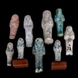 ANTIQUITIES - a group of Ancient Egyptian pottery shabti figures, including 4 faience glaze and some