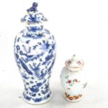 A Chinese famille rose porcelain vase and cover, height 13.5cm, and a blue and white porcelain